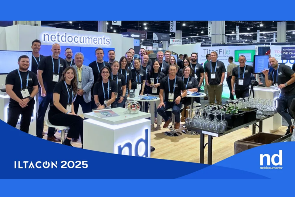 Exhibitors at a legal technology booth during ILTACON 2025