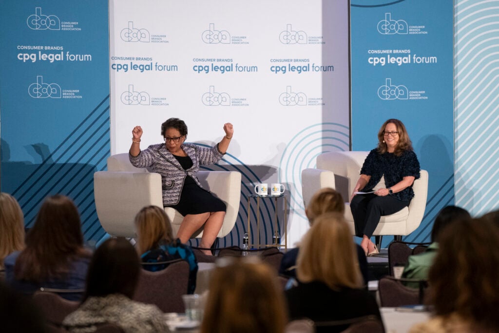 Speakers engage in a panel discussion before an audience at the Consumer Brands CPG Legal Forum